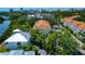 Aerial of condo community showcasing tropical landscaping, mature trees and convenient parking at 850 S Tamiami Trl # 431, Sarasota, FL 34236