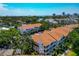 Aerial view of beautiful condo community surrounded by lush, mature trees and community parking at 850 S Tamiami Trl # 431, Sarasota, FL 34236
