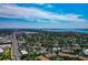 Panoramic aerial of the city showcasing lush residential areas, canals, and coastline at 850 S Tamiami Trl # 431, Sarasota, FL 34236