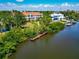 Waterfront community with lush tropical trees, dock, and nearby residences and boat slips at 850 S Tamiami Trl # 431, Sarasota, FL 34236