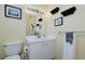 A bathroom with new vanity, toilet, and decorative touches at 850 S Tamiami Trl # 431, Sarasota, FL 34236