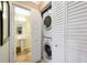 View of bathroom with pedestal sink and washer and dryer at 850 S Tamiami Trl # 431, Sarasota, FL 34236