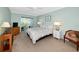 Bright bedroom features a ceiling fan and sliding glass doors to a private balcony at 850 S Tamiami Trl # 431, Sarasota, FL 34236