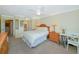 Bedroom with queen bed, en-suite bathroom, and a closet at 850 S Tamiami Trl # 431, Sarasota, FL 34236