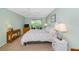 Bedroom features ceiling fan and private balcony at 850 S Tamiami Trl # 431, Sarasota, FL 34236