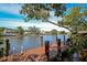 Community dock with seating and water access, ideal for enjoying waterfront views and activities at 850 S Tamiami Trl # 431, Sarasota, FL 34236
