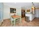 Bright dining area with tile floors, stainless appliances, and warm pendant lighting at 850 S Tamiami Trl # 431, Sarasota, FL 34236