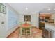 Bright dining area with tile flooring, plantation shutters, and stainless steel appliances at 850 S Tamiami Trl # 431, Sarasota, FL 34236