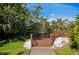 A charming wooden entryway and a short walk to the community dock area at 850 S Tamiami Trl # 431, Sarasota, FL 34236