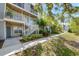 Beautiful condo building with well-maintained lawn and tropical landscaping at 850 S Tamiami Trl # 431, Sarasota, FL 34236