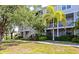 A beautiful condo building with screened in patios, green grass, and well maintained landscaping at 850 S Tamiami Trl # 431, Sarasota, FL 34236