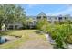 Beautiful condo with a well-manicured lawn and lush landscaping with views of the pond at 850 S Tamiami Trl # 431, Sarasota, FL 34236