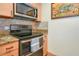 The kitchen has granite counters, stainless steel appliances, and a range oven at 850 S Tamiami Trl # 431, Sarasota, FL 34236