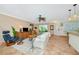 Inviting living room featuring tile floors, a comfortable sofa, and a slider to the lanai at 850 S Tamiami Trl # 431, Sarasota, FL 34236