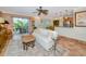 Open-concept living room featuring access to lanai, kitchen counter, and comfortable seating at 850 S Tamiami Trl # 431, Sarasota, FL 34236