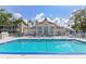 Beautiful community pool with lounge chairs and a clubhouse at 850 S Tamiami Trl # 431, Sarasota, FL 34236