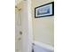 Bathroom shower with tub and decorative picture above toilet at 850 S Tamiami Trl # 431, Sarasota, FL 34236