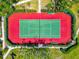 Aerial view of community tennis court with manicured grounds at 850 S Tamiami Trl # 431, Sarasota, FL 34236