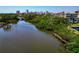 Scenic waterfront view with docks, lush greenery, and cityscape in the background at 850 S Tamiami Trl # 431, Sarasota, FL 34236
