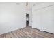 Bright bedroom with wood-look flooring and closet at 8622 Inwood Dr, Hudson, FL 34667