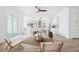 Open living space seamlessly connects to the kitchen, highlighted by modern furnishings and a light-filled atmosphere at 8622 Inwood Dr, Hudson, FL 34667