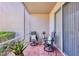 Relaxing screened patio with comfortable seating and views of lush landscaping at 8931 Veranda Way # 415, Sarasota, FL 34238