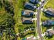 Aerial view of this home, its landscaping and location in a neighborhood with sidewalks and winding pathways at 10171 Milky Way Cir, Sarasota, FL 34241