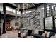 Bright amenity features a climbing wall and seating area with modern decor and tall ceilings at 10171 Milky Way Cir, Sarasota, FL 34241