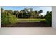 A lovely backyard is presented from the lanai at 10171 Milky Way Cir, Sarasota, FL 34241
