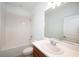 Bathroom featuring a combined tub and shower with white tile and a modern single sink vanity at 10171 Milky Way Cir, Sarasota, FL 34241