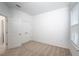 This bedroom has carpet flooring, a window with blinds, and a double door closet at 10171 Milky Way Cir, Sarasota, FL 34241
