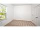 Well-lit bedroom with neutral carpet and a window for natural light at 10171 Milky Way Cir, Sarasota, FL 34241