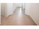 Hallway featuring tile flooring and white trim at 10171 Milky Way Cir, Sarasota, FL 34241