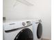 The laundry room features a Samsung front load washer and dryer, as well as, a wire rack above at 10171 Milky Way Cir, Sarasota, FL 34241