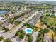 Aerial view of a residential neighborhood with a pool and lush landscaping at 11508 Griffith Park Ter, Bradenton, FL 34211