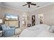 Well-appointed bedroom with TV, dresser, comfortable chair, and walk-in closet creating a relaxing private retreat at 11508 Griffith Park Ter, Bradenton, FL 34211