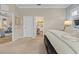 Serene bedroom entrance, highlighting the transition to the kitchen and living areas, offering a glimpse of a well-connected home at 11508 Griffith Park Ter, Bradenton, FL 34211