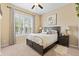 Cozy bedroom with a queen bed, shuttered windows, and calm decor elements at 11508 Griffith Park Ter, Bradenton, FL 34211