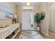Inviting foyer with elegant console table, showcasing a seamless entryway with tiled flooring at 11508 Griffith Park Ter, Bradenton, FL 34211
