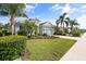 Well-manicured front lawn with attractive landscaping, inviting curb appeal and a two-car garage at 11508 Griffith Park Ter, Bradenton, FL 34211