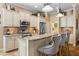 Stylish kitchen featuring granite countertops, stainless steel appliances, and breakfast bar seating at 11508 Griffith Park Ter, Bradenton, FL 34211