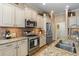 Gourmet kitchen featuring stainless steel appliances, granite counters, and a stylish tile backsplash at 11508 Griffith Park Ter, Bradenton, FL 34211