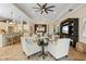Open-concept living area with stylish furnishings, seamlessly connecting the kitchen and dining spaces at 11508 Griffith Park Ter, Bradenton, FL 34211