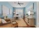Bright, blue home office featuring a large desk, comfortable seating, and modern amenities, perfect for productivity at 11508 Griffith Park Ter, Bradenton, FL 34211