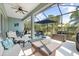 Spacious screened patio with comfortable seating and relaxing outdoor decor at 11508 Griffith Park Ter, Bradenton, FL 34211