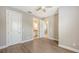 An empty bedroom with hard wood floors, and access to another room and bathroom at 12619 Sorrento Way, Bradenton, FL 34211