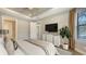 Bedroom with hardwood floors, plant, and neutral decor with serene retreat at 12619 Sorrento Way, Bradenton, FL 34211