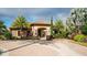 Inviting clubhouse with stone accents, tiled roof, lush landscaping, and a welcoming entrance at 12619 Sorrento Way, Bradenton, FL 34211