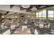 A light-filled dining area with views of the lake at 12619 Sorrento Way, Bradenton, FL 34211