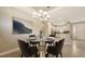 Dining area adjacent to kitchen, featuring elegant chandelier, and neutral tones at 12619 Sorrento Way, Bradenton, FL 34211